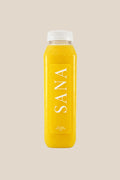 Bottle of Golden Hour Juice, organic cold-pressed orange, pineapple, ginger and lemon juice by SANA Wellness Bar, Orlando