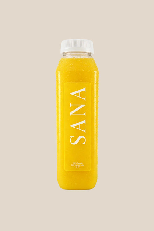 Bottle of Golden Hour Juice, organic cold-pressed orange, pineapple, ginger and lemon juice by SANA Wellness Bar, Orlando