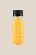 Metabolic Bomb Shot bottle, organic cold-pressed apple, celery, lemon, ginger and cayenne shot by SANA Wellness Bar, Orlando