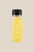Pineapple Ginger Shot bottle, organic cold-pressed pineapple, ginger and lemon wellness shot by SANA Wellness Bar, Orlando