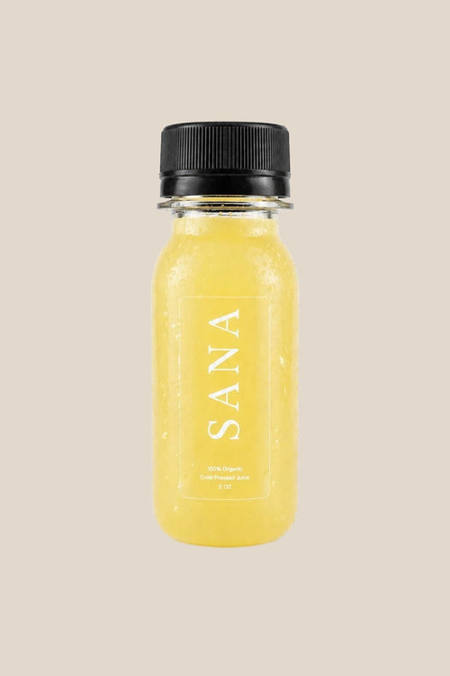 Pineapple Ginger Shot bottle, organic cold-pressed pineapple, ginger and lemon wellness shot by SANA Wellness Bar, Orlando