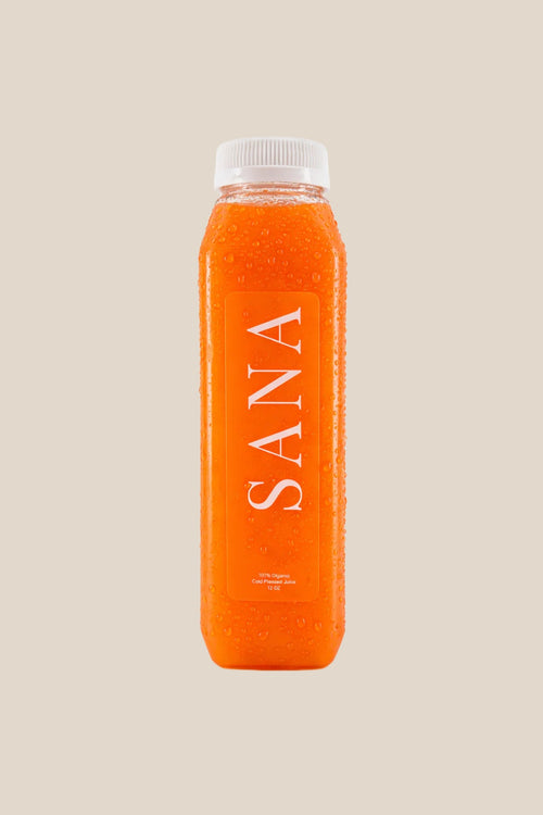 Bottle of Citrus Glow Juice, organic cold-pressed orange, pineapple, carrot and turmeric juice by SANA Wellness Bar, Orlando