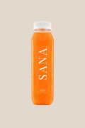 Bottle of Sunshine Juice, organic cold-pressed pineapple, carrot, orange and lime juice by SANA Wellness Bar, Orlando
