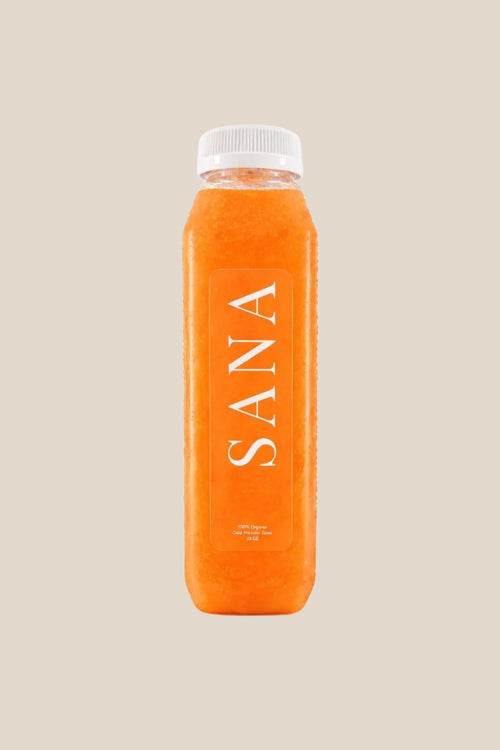 Bottle of Sunshine Juice, organic cold-pressed pineapple, carrot, orange and lime juice by SANA Wellness Bar, Orlando
